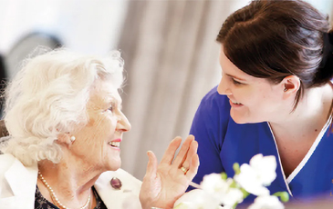 Resident talking with carer