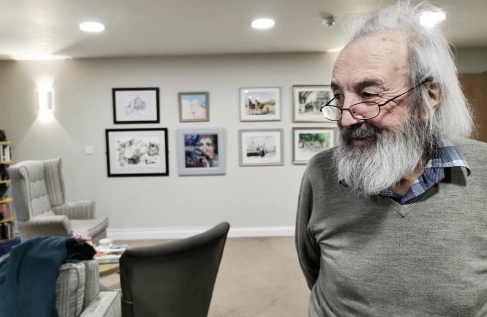 Resident looking at painting