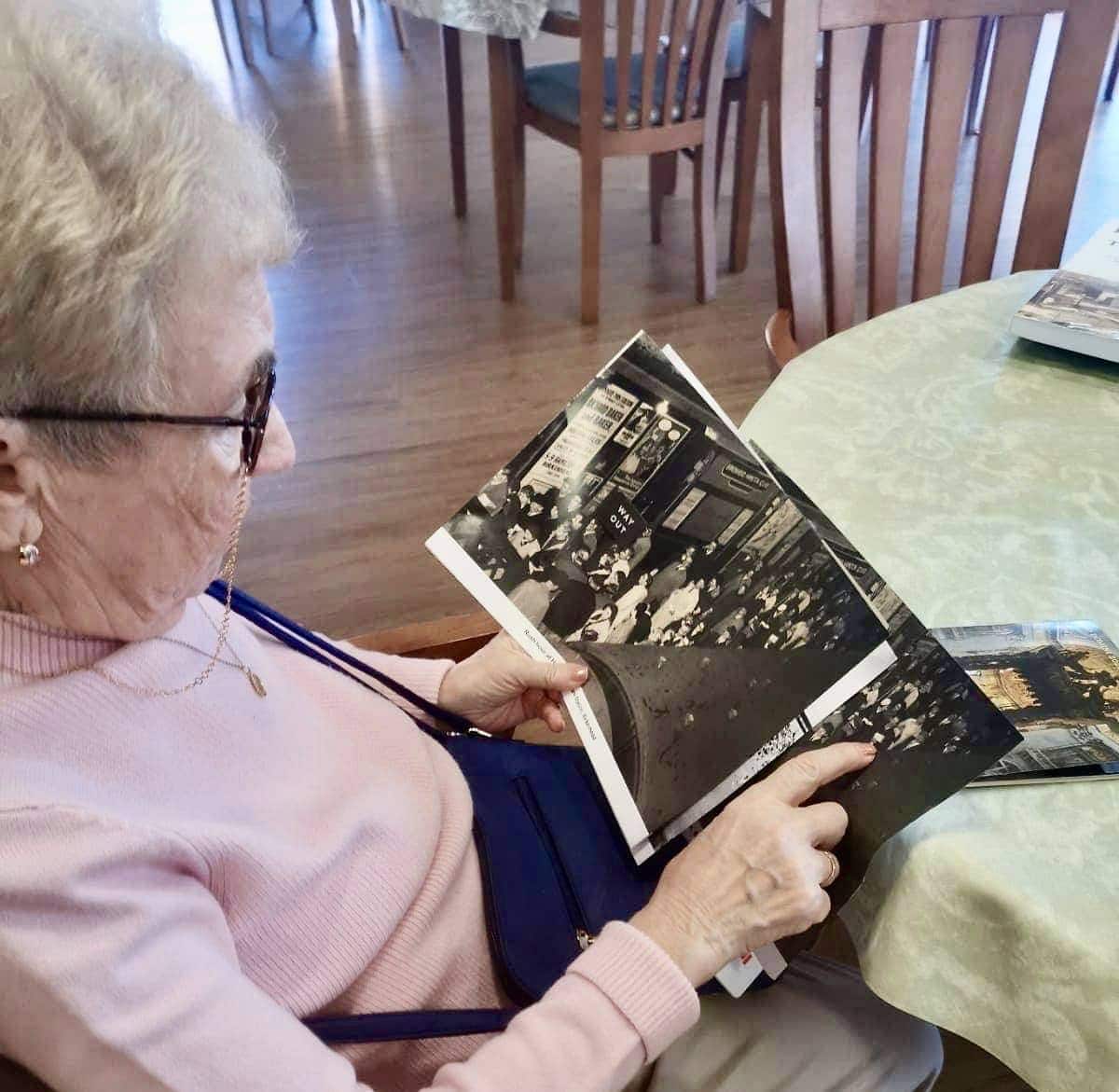 resident reminiscing about past with photo