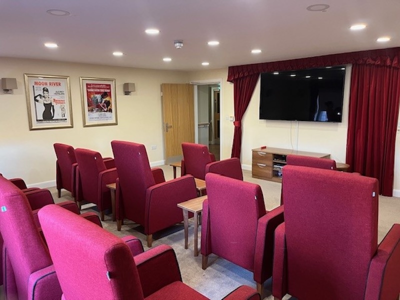 cinema room with red chairs