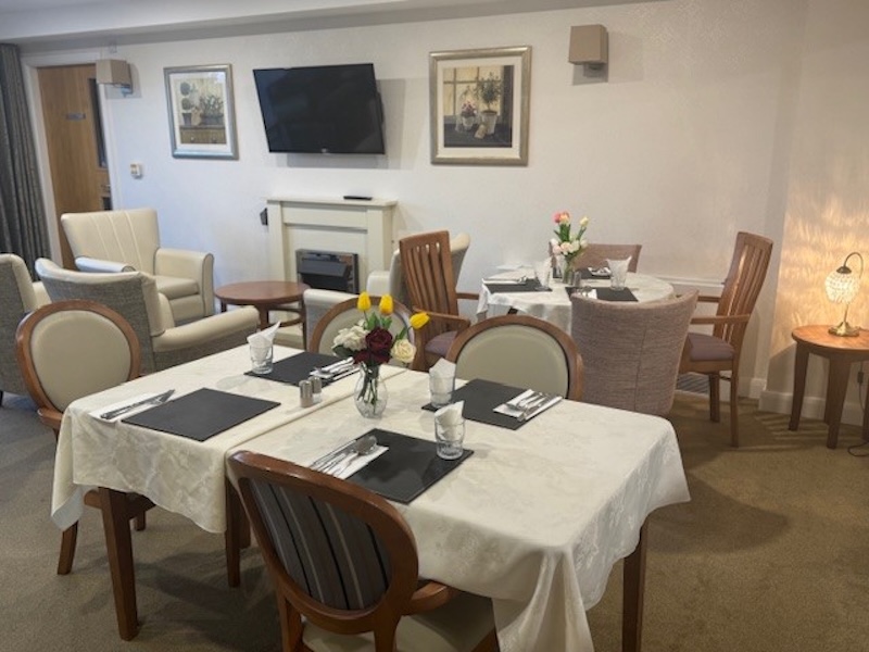 dining room with several tables and chairs set up