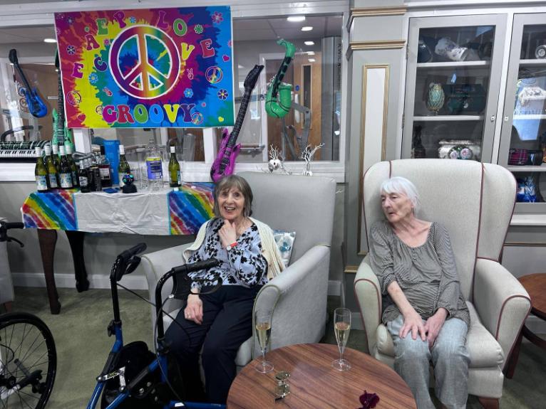 two ladies sat in chairs