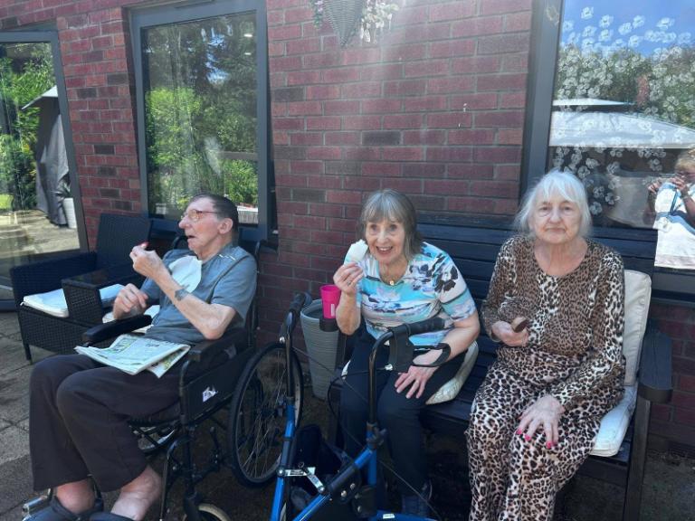 older adults sat outside