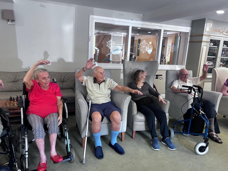 a group of residents doing an exercise class together