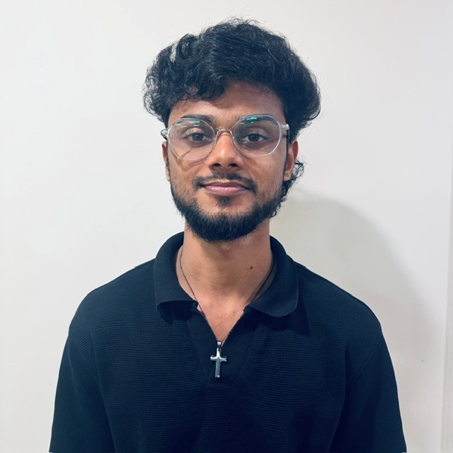 man standing for staff photo